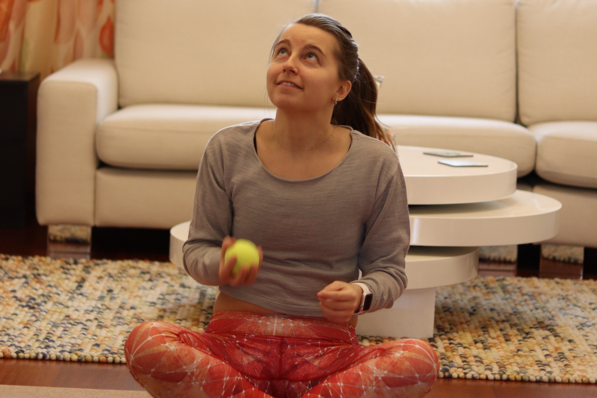 Juggling with one hand and two balls, while sitting down Juggling with one hand and two balls, while sitting down